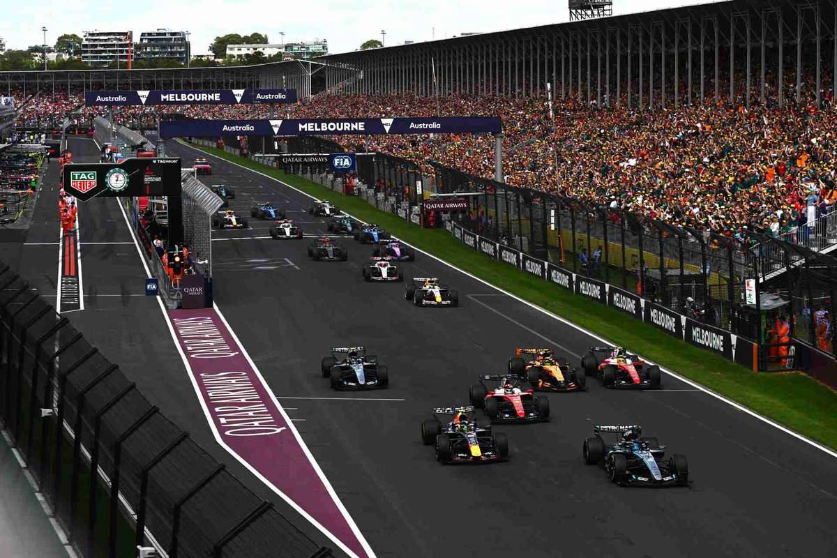 Mercedes team celebrating a 1–2 finish with George Russell and Kimi Antonelli together on the podium