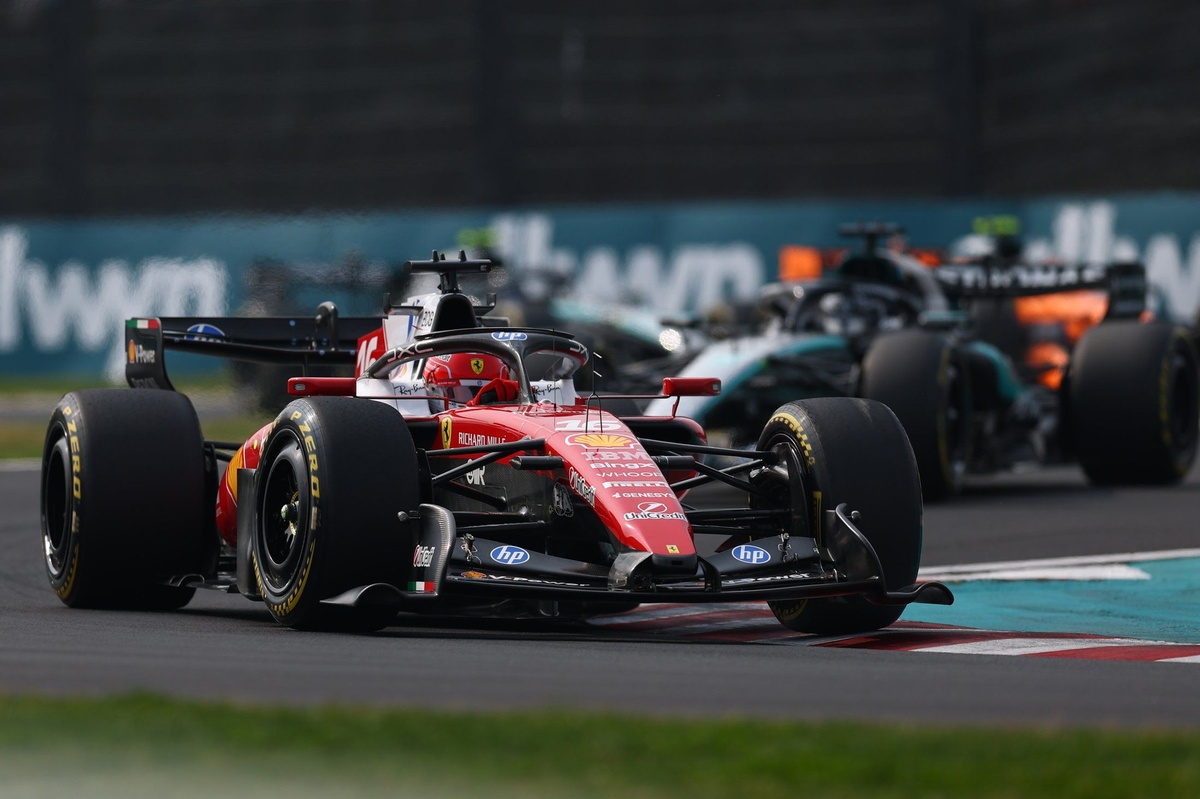 Mercedes cars of Kimi Antonelli and George Russell lead into the first corner during the start of the 2026 Chinese Grand Prix