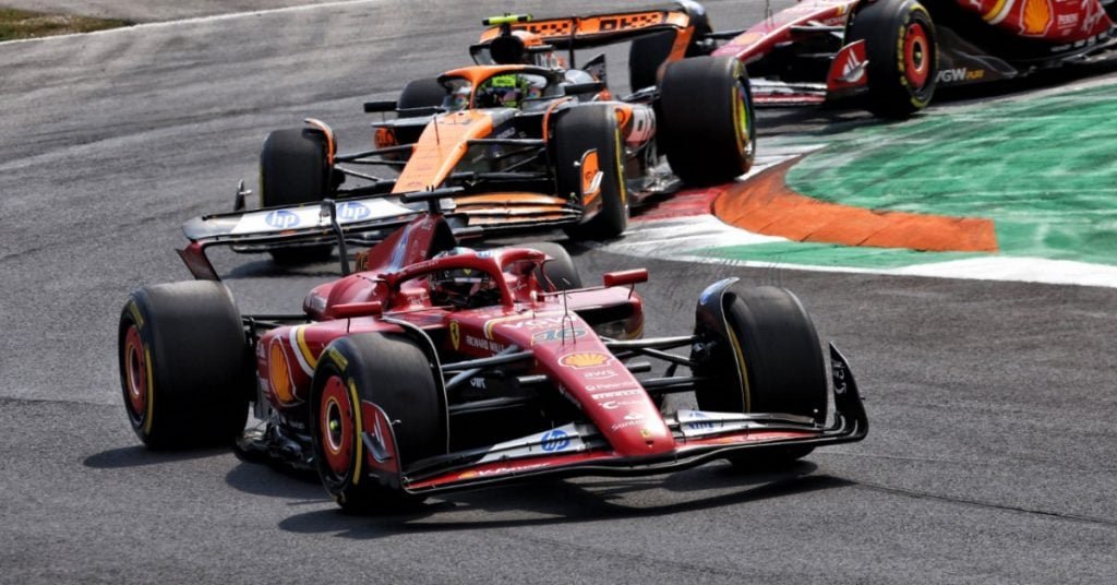 Charles Leclerc celebrating a Formula 3 victory on the podium with his helmet in hand