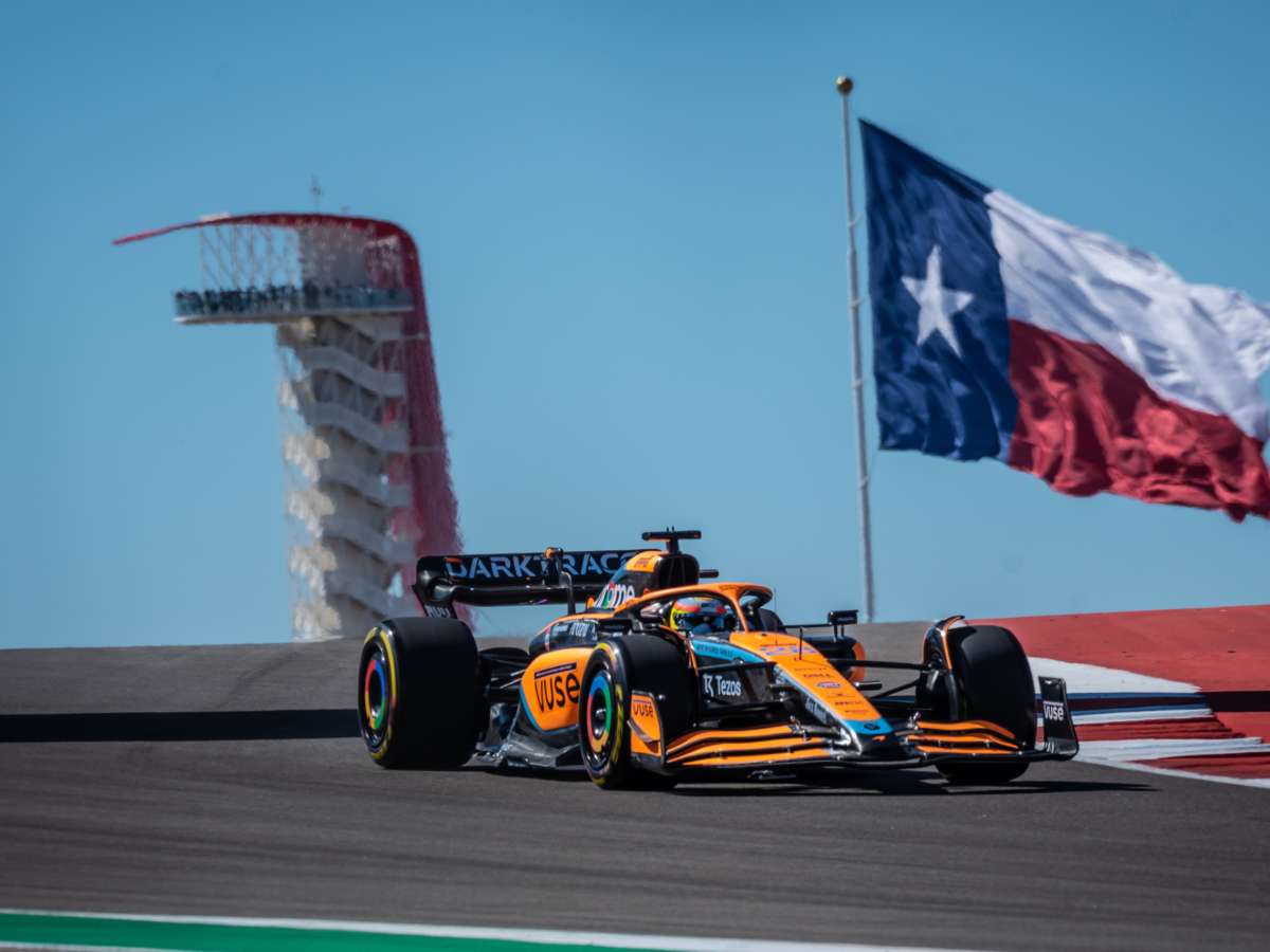 Formula 1 car cresting the hill into Turn 1 at COTA under heavy braking