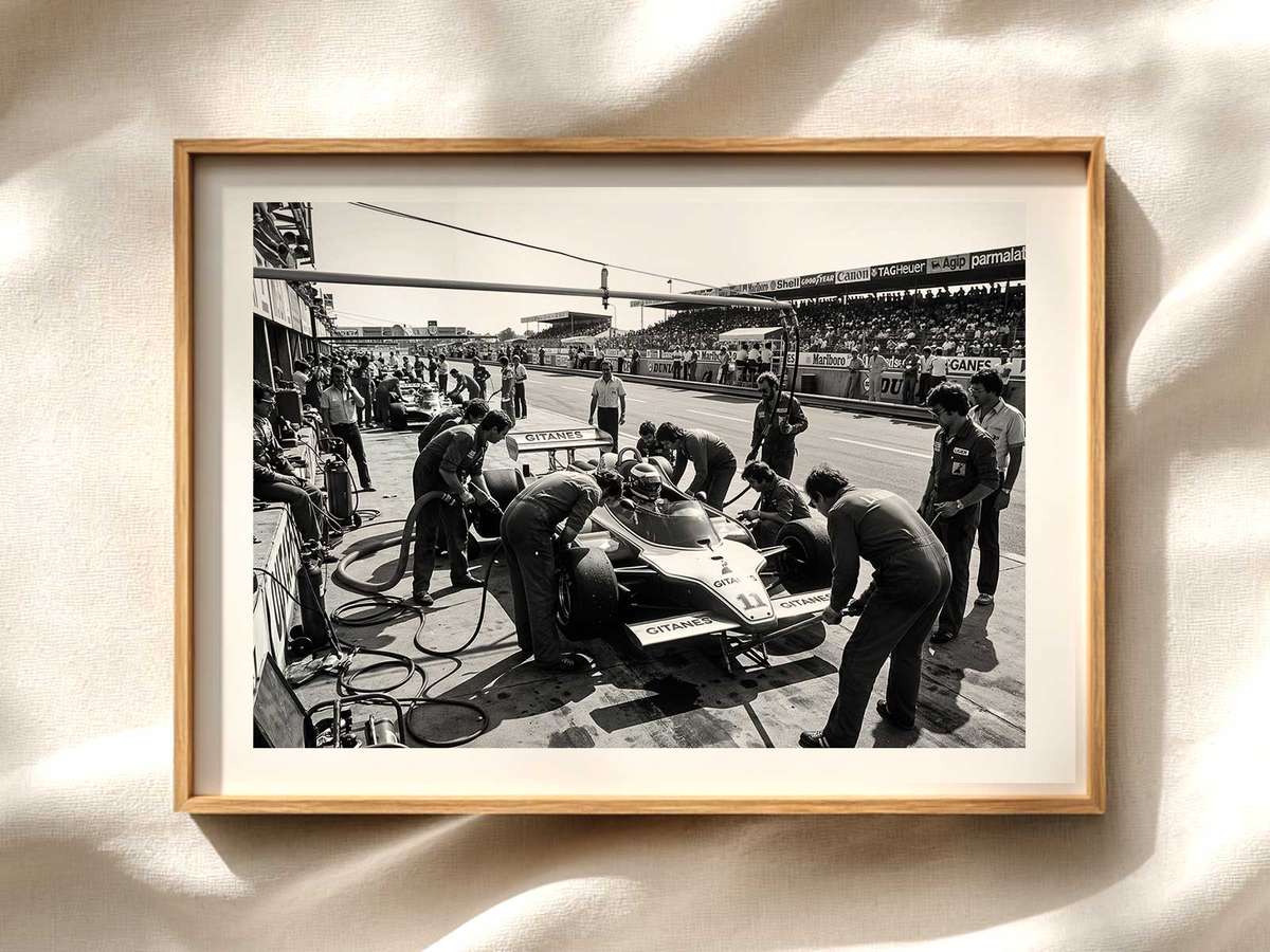 Pit Stop Close-Up: Wheel Change in Motion Formula 1 poster displayed as motorsport wall art