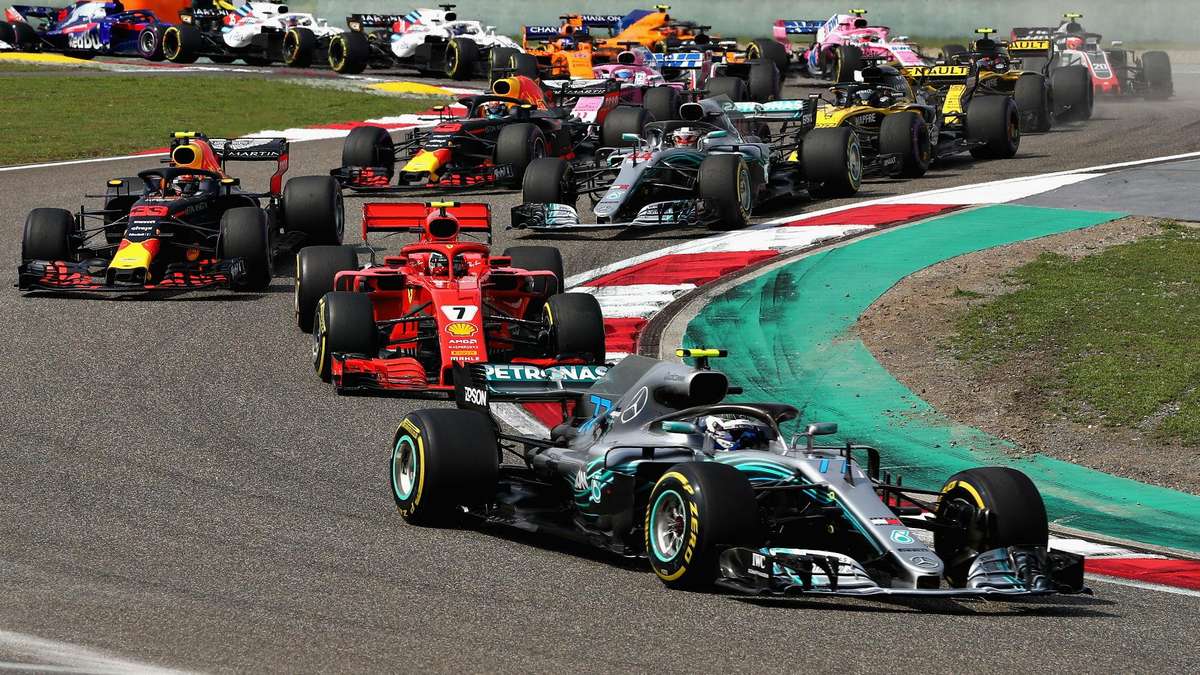 Max Verstappen standing on the podium in second place at the 2026 Hungarian Grand Prix, showing his helmet and race suit
