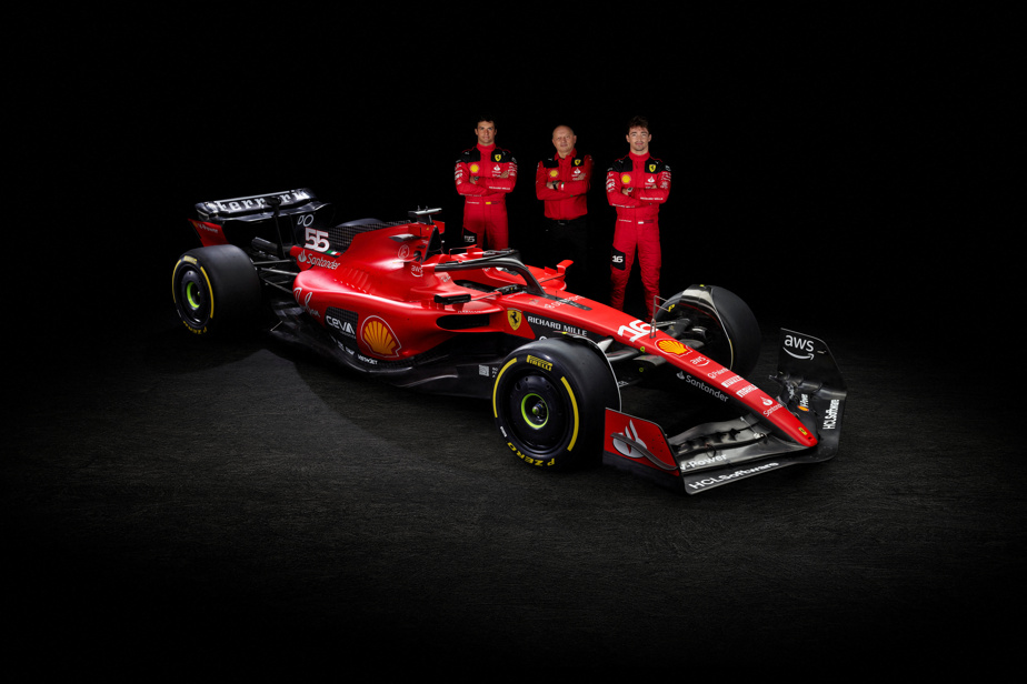 Ferrari F1 driver seated in cockpit demonstrating aggressive braking posture with feet on pedals