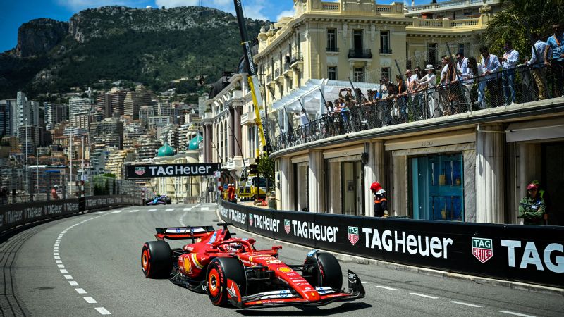 Lewis Hamilton crossing the finish line and acknowledging the crowd after finishing second at the 2026 Monaco Grand Prix