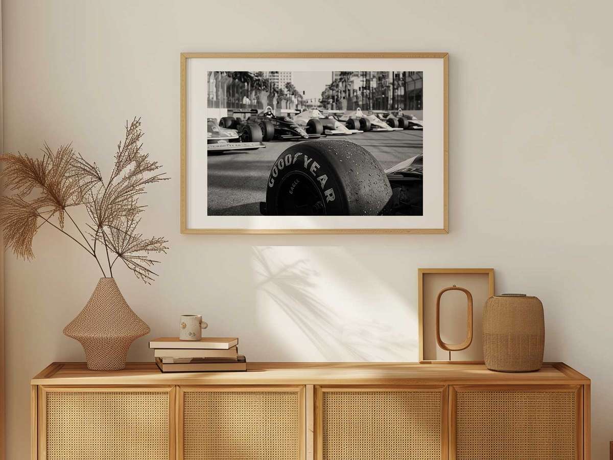 Cars slipstreaming down a long straight with a visible heavy braking zone ahead, illustrating overtaking window