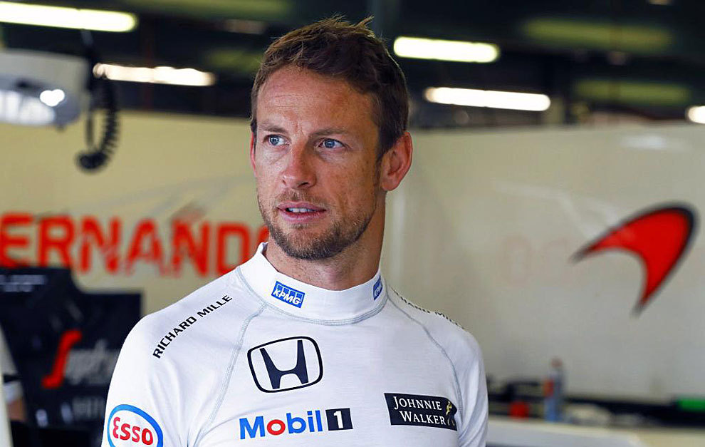 Jenson Button racing in a Formula 3 car, negotiating a corner at high speed