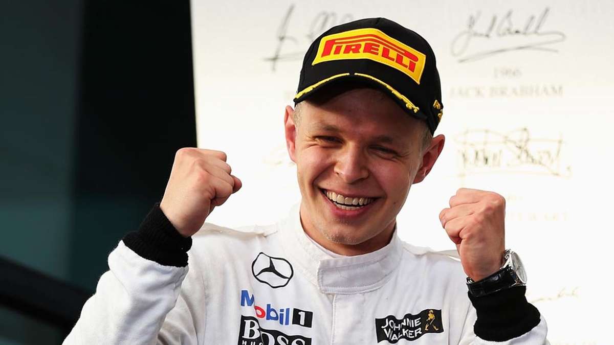 Kevin Magnussen celebrating on the podium after a junior formula race victory