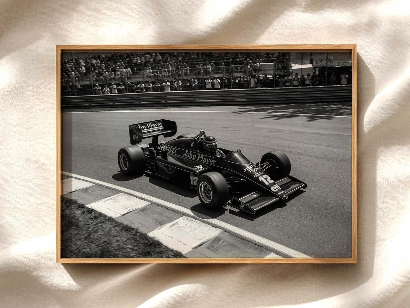 Low-angle shot of the Lotus F1 car emphasizing towering silhouette and aggressive stance