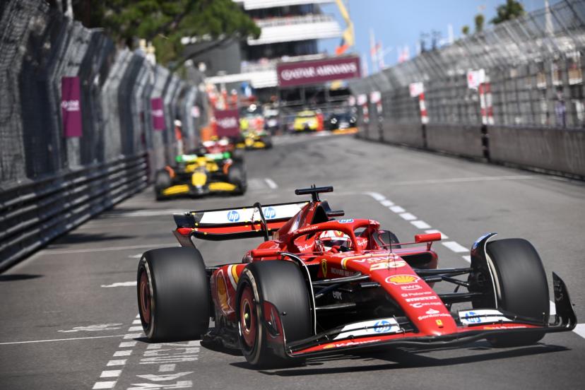 Cars navigating the complex sequence around Casino Square with multi-apex turns and elevation changes
