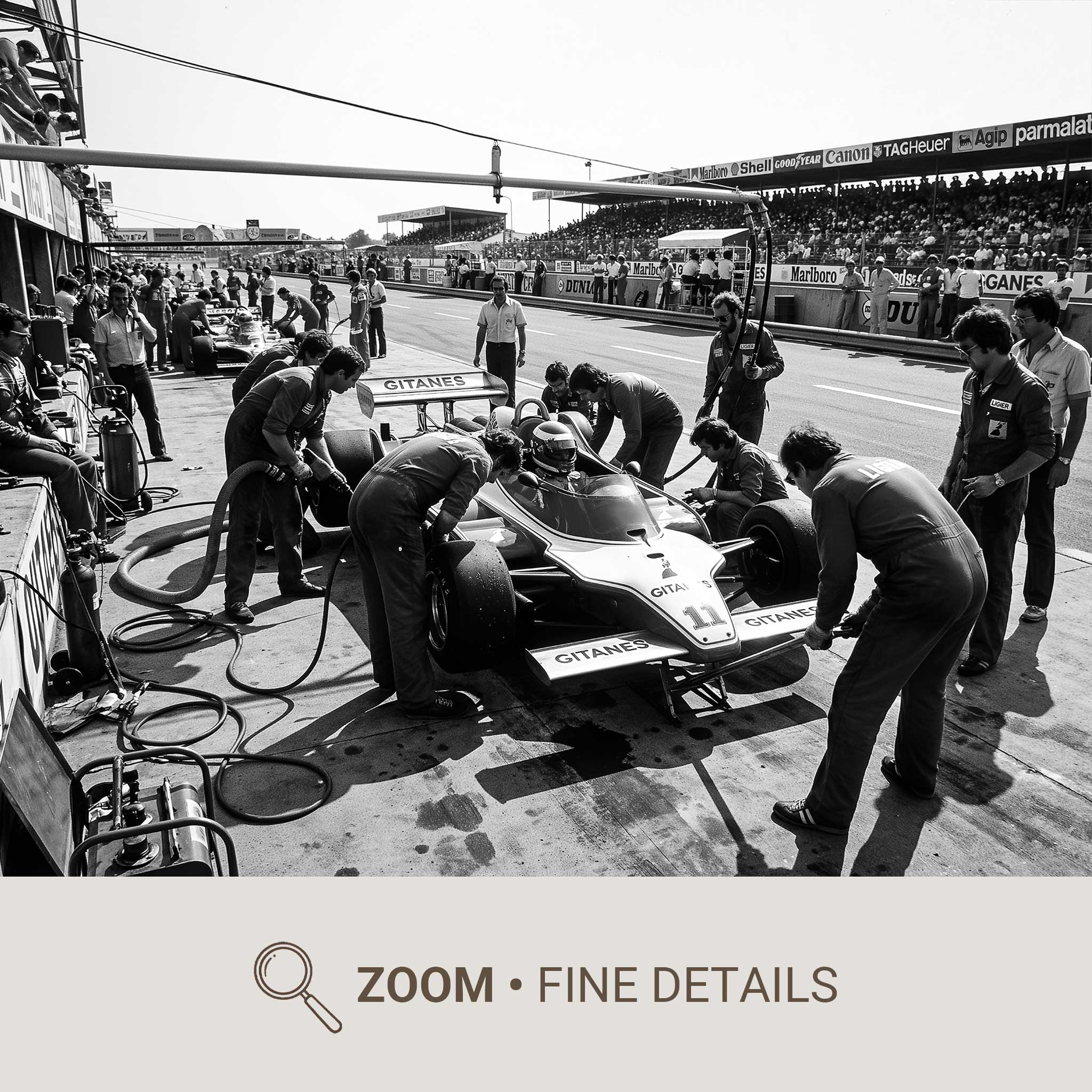 Action shot with motion blur of tyre removal and replacement at a Formula One pit stop, conveying speed, rhythm, and…