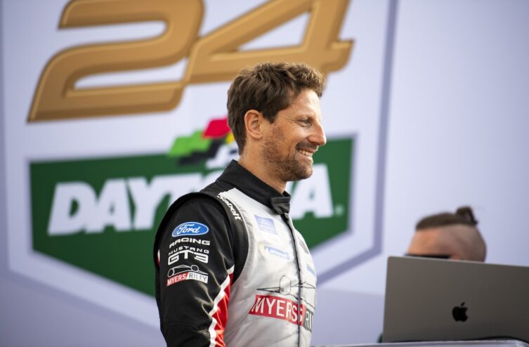 Romain Grosjean battling wheel-to-wheel with a rival at a high-speed corner
