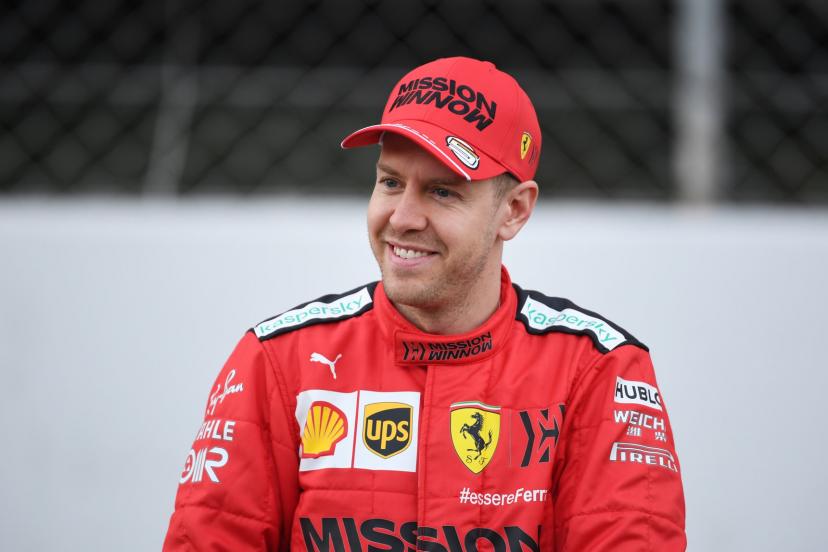 Onboard camera view from Sebastian Vettel's cockpit showing a late turn-in with steering input and apex approach