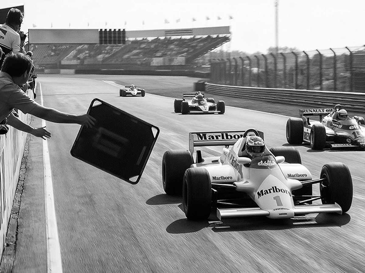 Close-up view of an open-wheel Formula 1 car focusing on aerodynamic details and textured bodywork